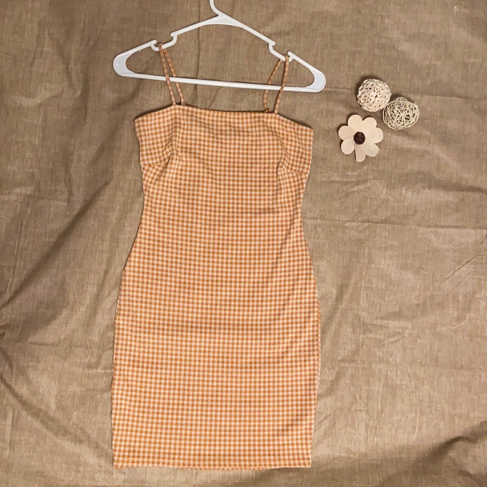Orange and white plaid dress.